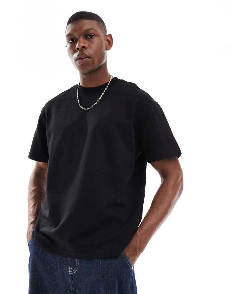 Bershka - Kurzärmliges, weiches T-Shirt in Schwarz Bershka - Kurzärmliges, weiches T-Shirt in Schwarz von Bershka