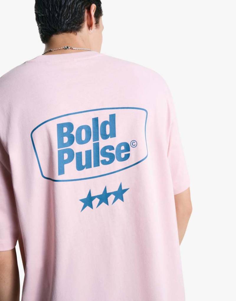 Bershka - Kurzärmliges T-Shirt in Rosa mit Print von Bershka