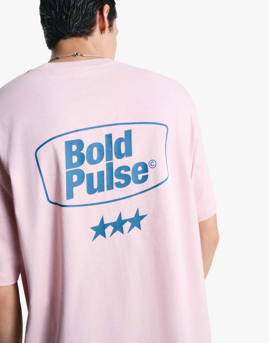 Bershka - Kurzärmliges T-Shirt in Rosa mit Print von Bershka