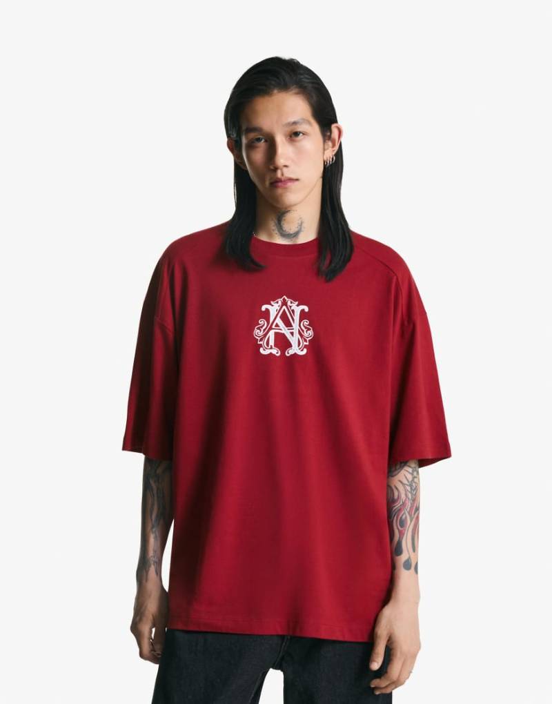 Bershka - Kurzärmliges T-Shirt in Rot mit Print von Bershka