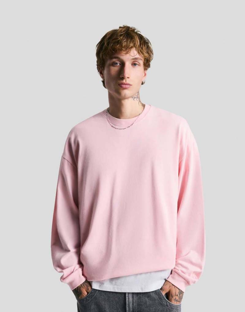 Bershka - Langärmliges, kastiges T-Shirt in Rosa von Bershka