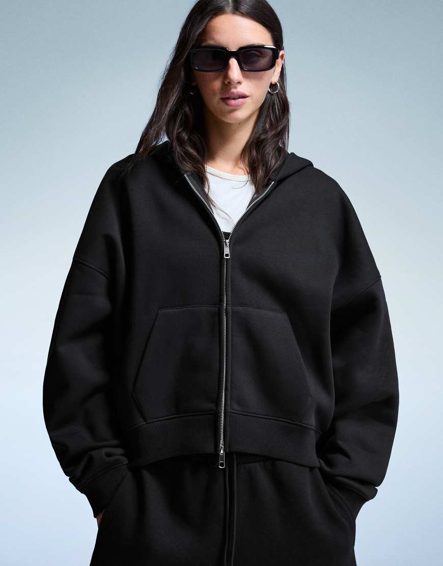 Bershka - Oversize-Kapuzenpullover in Schwarz mit Reißverschluss von Bershka