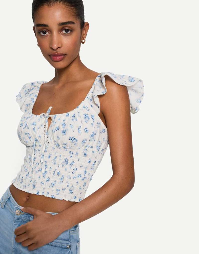 Bershka - Rustikales, gerafftes Top in Weiß mit Blumenprint-Gelb Bershka - Rustikales, gerafftes Top in Weiß mit Blumenprint-Gelb von Bershka