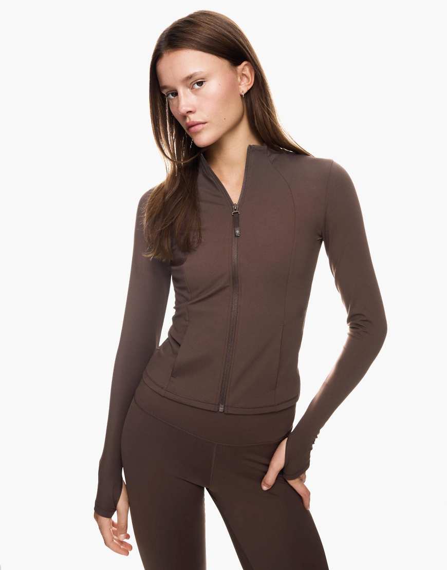 Bershka - Schnelltrocknende und atmungsaktive Jacke in Braun mit Reißverschluss-Brown Bershka - Schnelltrocknende und atmungsaktive Jacke in Braun mit Reißverschluss-Brown von Bershka