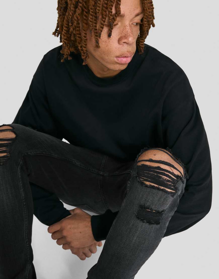 Bershka - Sehr enge Jeans in Schwarz mit Zierrissen von Bershka