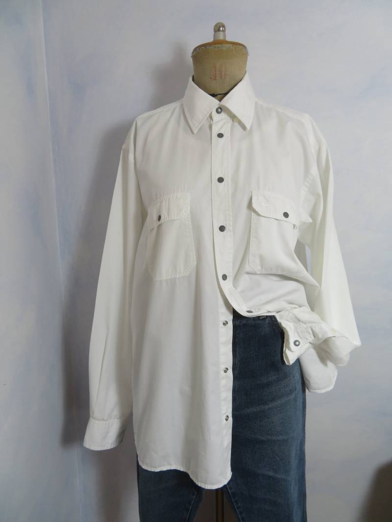 Vintage Camel Active Cowboy Hemd Size Xl Druckknopf Streifen Loose Fit Brusttaschen Langarm Blüten Weiß Twill 100% Baumwolle 80Er 90Er Vintage Camel Active Cowboy Hemd Size Xl Druckknopf Streifen Loose Fit Brusttaschen Langarm Blüten Weiß Twill 100% Baumwolle 80Er 90Er von BettysVintageHouse