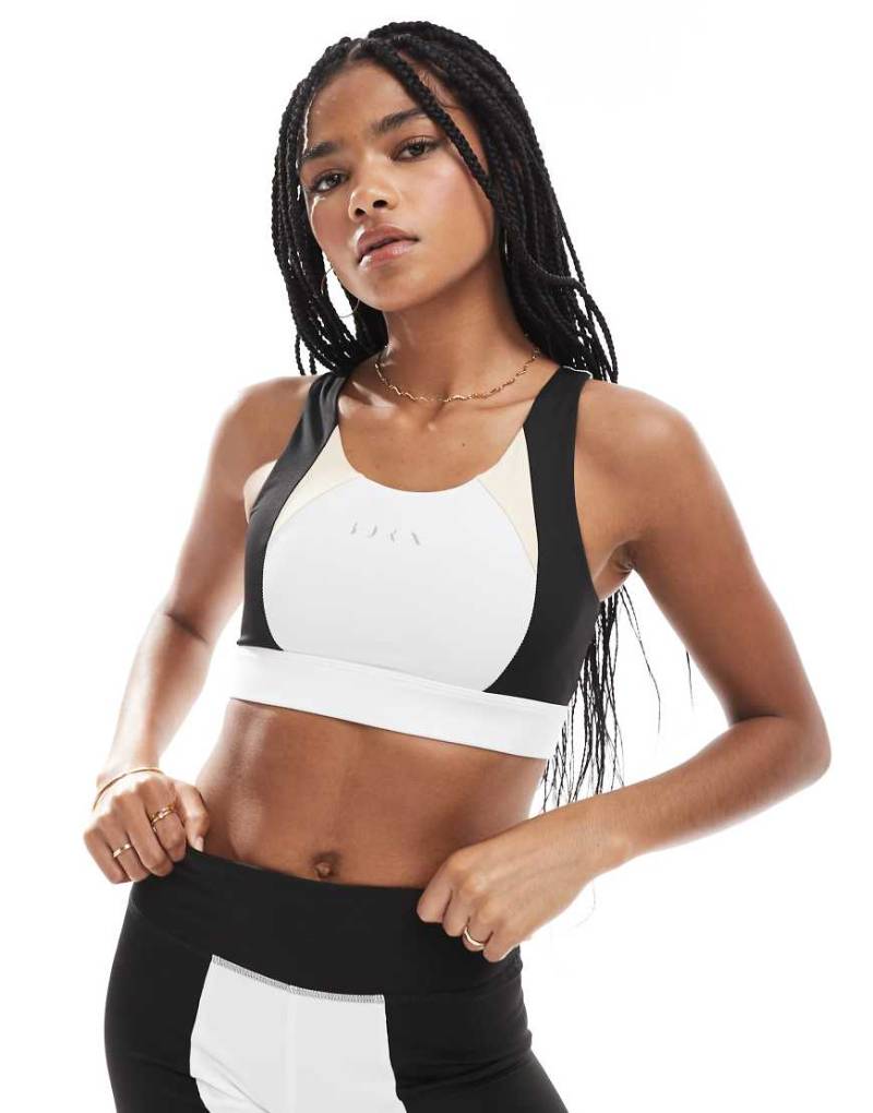 Born Living Yoga - Fiorella - Sport-BH in Schwarz/Steinbeige mit herausnehmbarer Wattierung-Bunt von Born Living Yoga