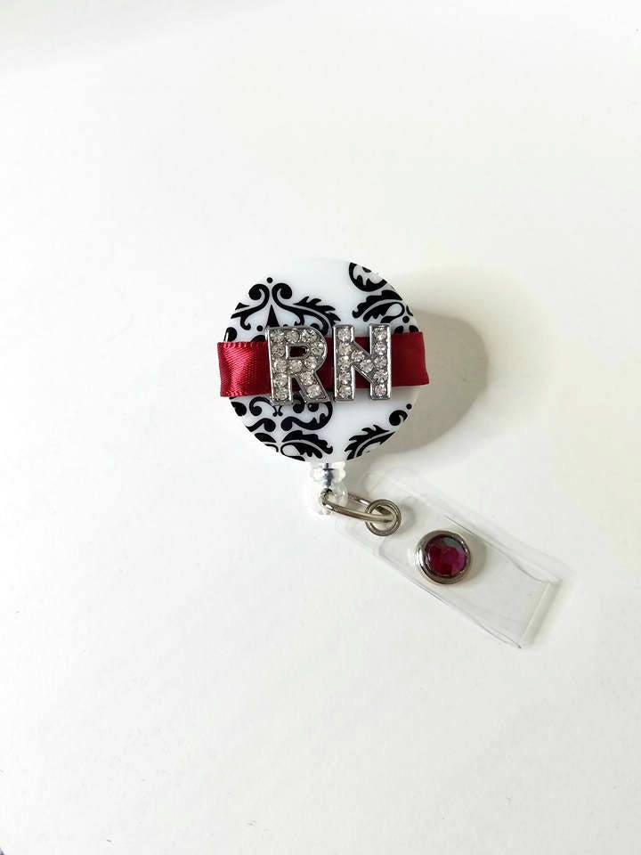 Rn Abzeichen Reel Strass Initial Damast Einziehbarer Ausweishalter Rn Abzeichen Reel Strass Initial Damast Einziehbarer Ausweishalter von BottleCapsGaloreNMor