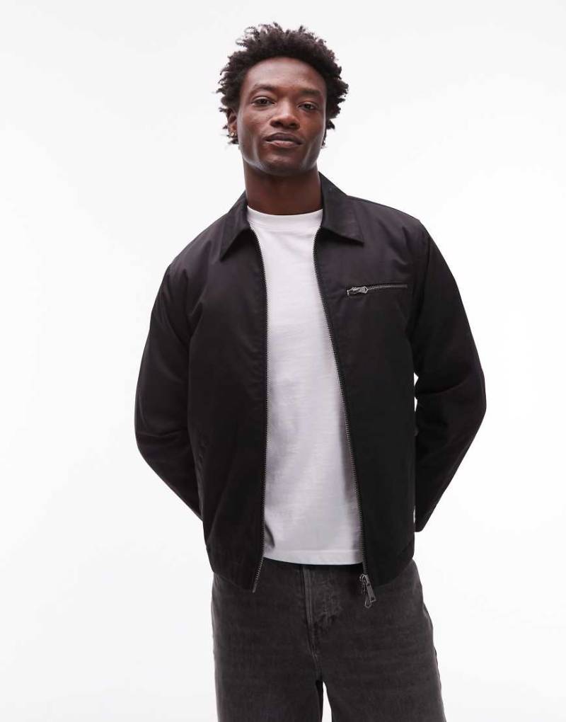 CAT - WWR - Jacke aus Twill in Schwarz mit gestepptem Futter und Zwei-Wege-Reißverschluss CAT - WWR - Jacke aus Twill in Schwarz mit gestepptem Futter und Zwei-Wege-Reißverschluss von CAT WWR