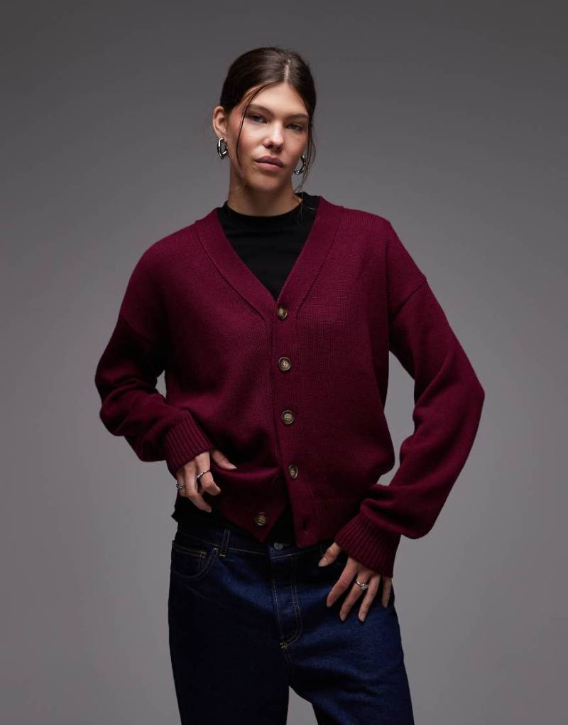 CAT - WWR - Strickjacke aus Merino-Wollmix in Burgunderrot mit lockerer Passform und Logo am Rücken von CAT WWR