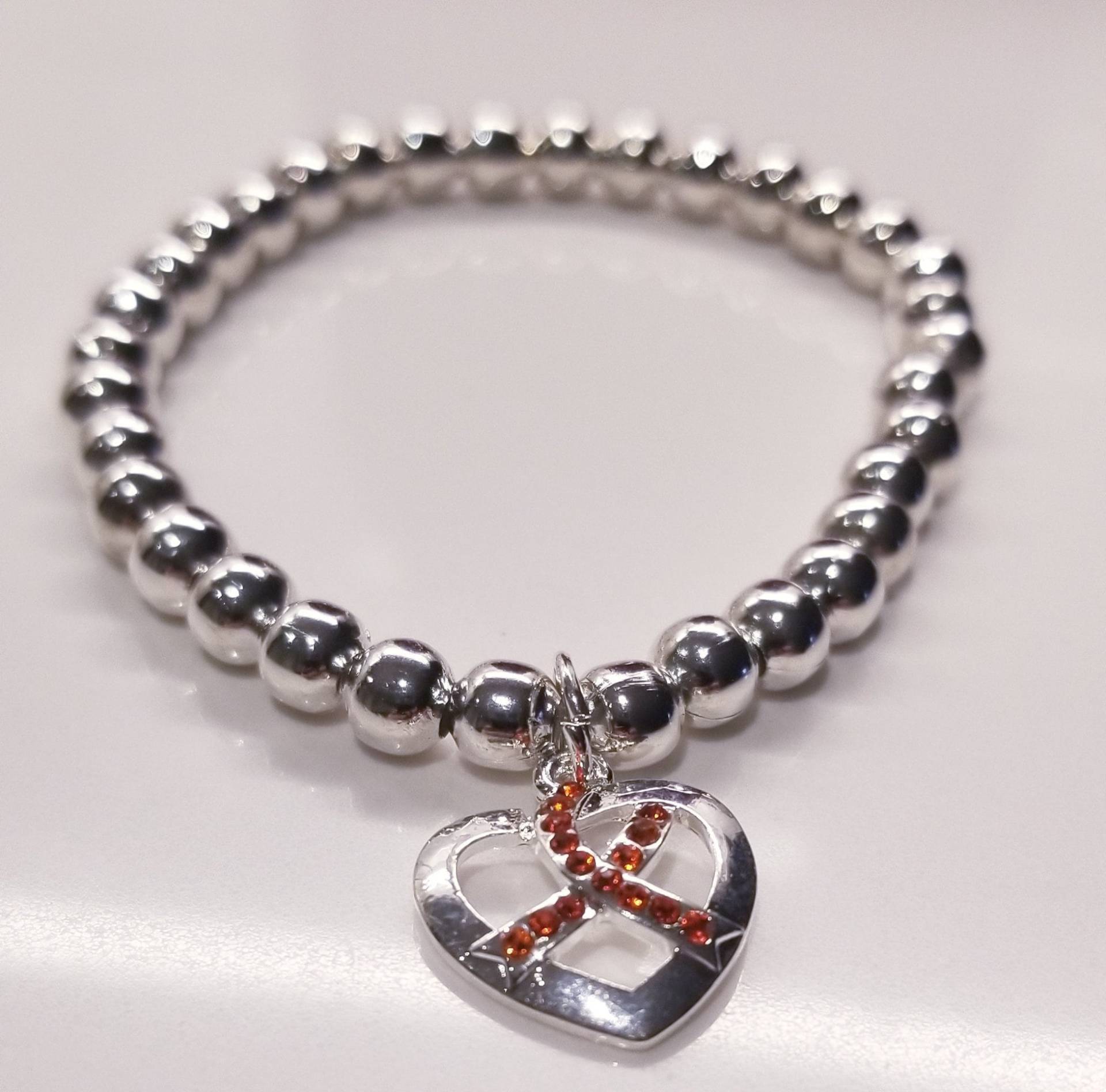 Ms Awareness, Silber Hämatit Stretch Armband Charmed Mit Charm Ms Awareness, Silber Hämatit Stretch Armband Charmed Mit Charm von CHARMEDByCuda
