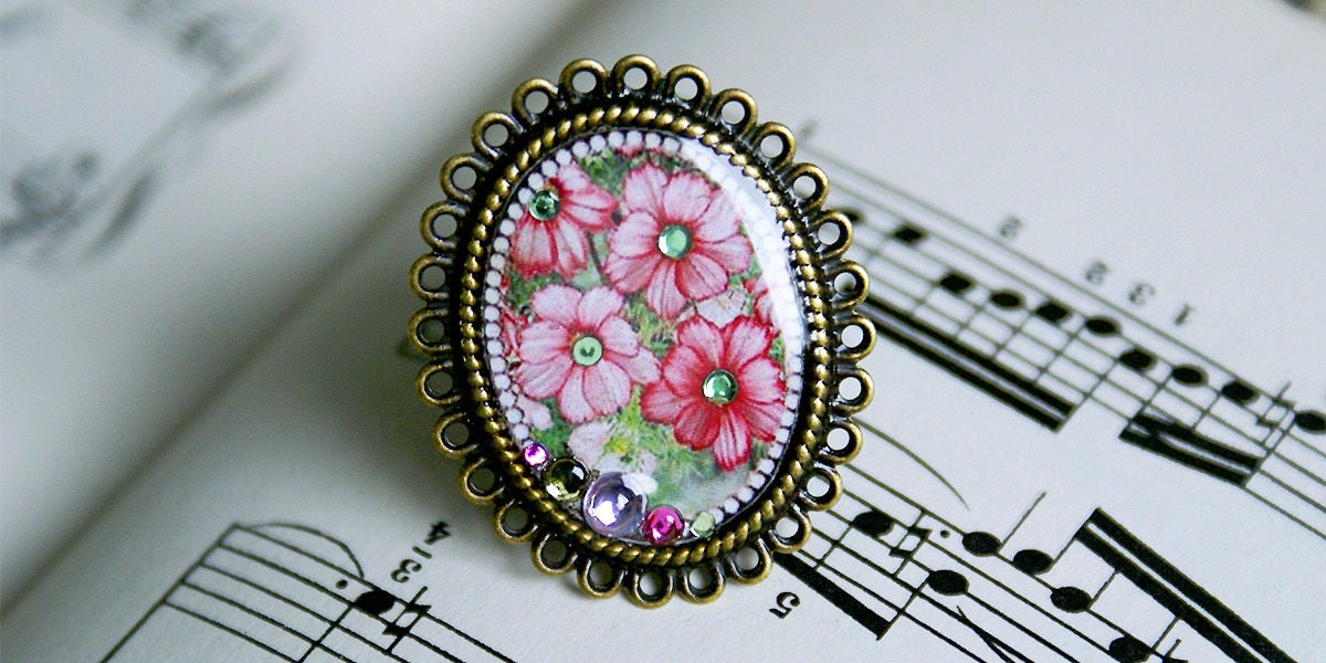 Bronze - Und Harzfarbener Metallring Mit Einer Blumenillustration von COMME1ange