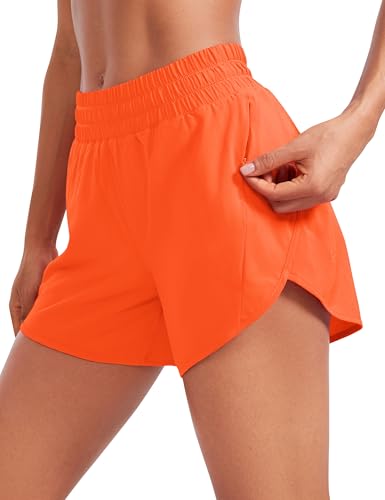 CRZ YOGA Damen Kurze Sporthose Mid Waist Laufhose Fitness Gym Kurz Hose Sportshorts mit Reißverschlusstasche Neon Orange 42 von CRZ YOGA