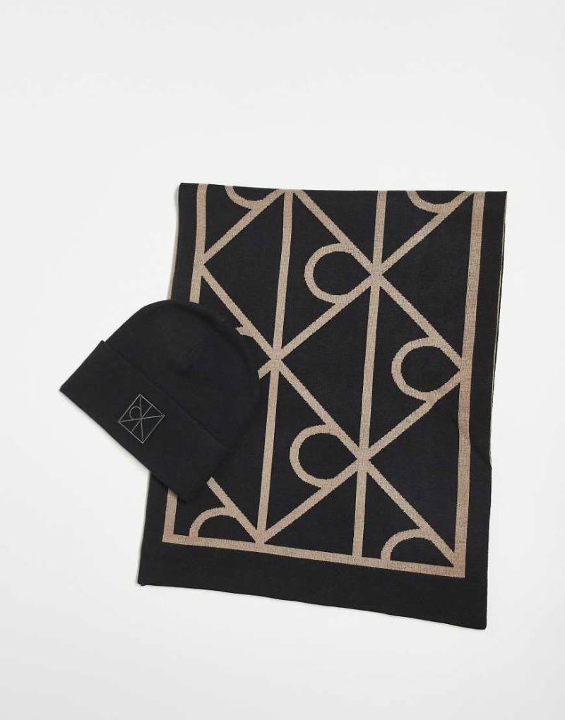Calvin Klein Jeans - Geschenkset aus Mütze und Schal in Schwarz mit Monogramm Calvin Klein Jeans - Geschenkset aus Mütze und Schal in Schwarz mit Monogramm von Calvin Klein Jeans