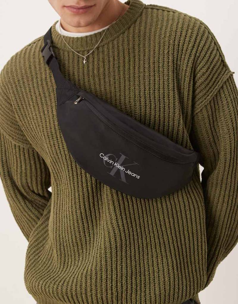 Calvin Klein Jeans - Gürteltasche mit Logo in Schwarz Calvin Klein Jeans - Gürteltasche mit Logo in Schwarz von Calvin Klein Jeans