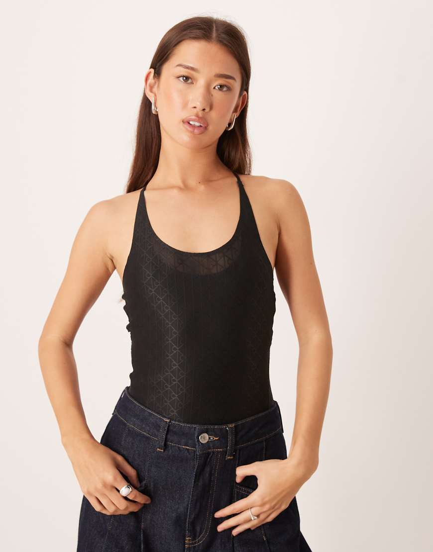 Calvin Klein Jeans - Netzstoff-Body in Schwarz mit Monogramm-Detail Calvin Klein Jeans - Netzstoff-Body in Schwarz mit Monogramm-Detail von Calvin Klein Jeans