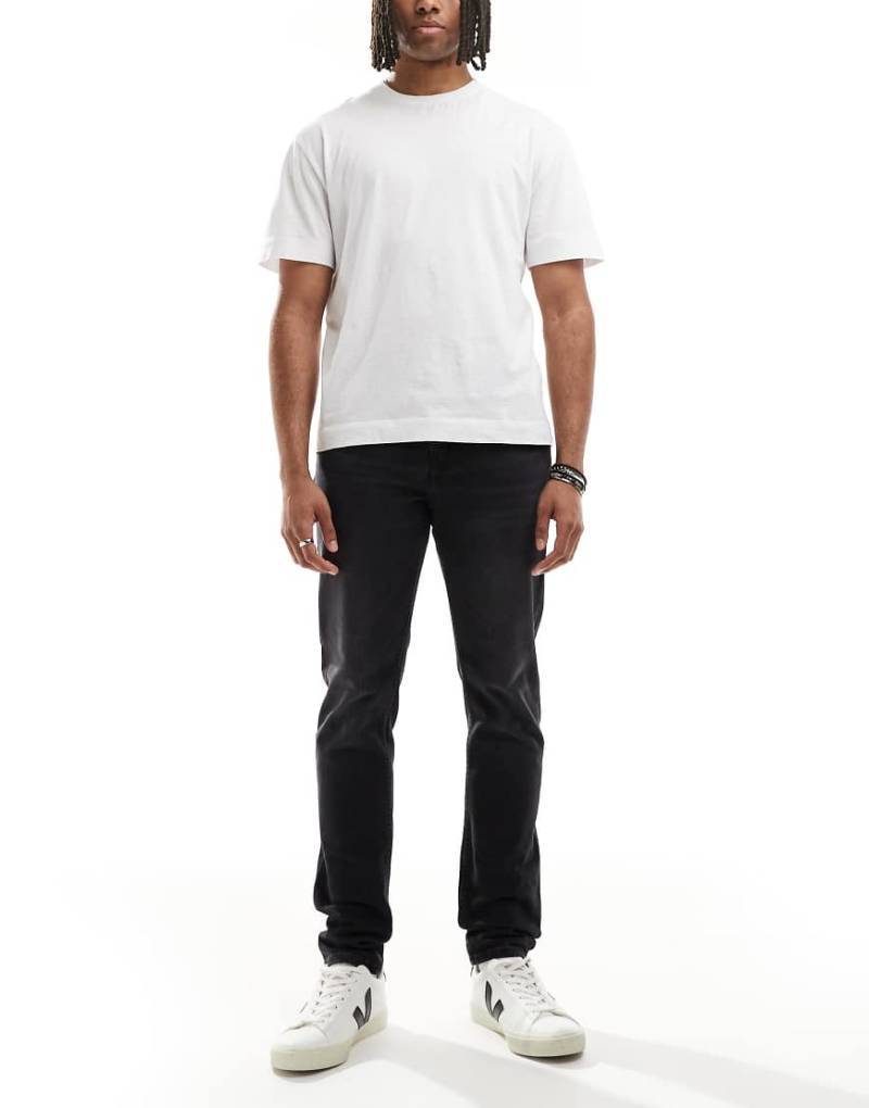 Calvin Klein Jeans - Schmal zulaufende Jeans in Schwarz mit schmalem Schnitt von Calvin Klein Jeans