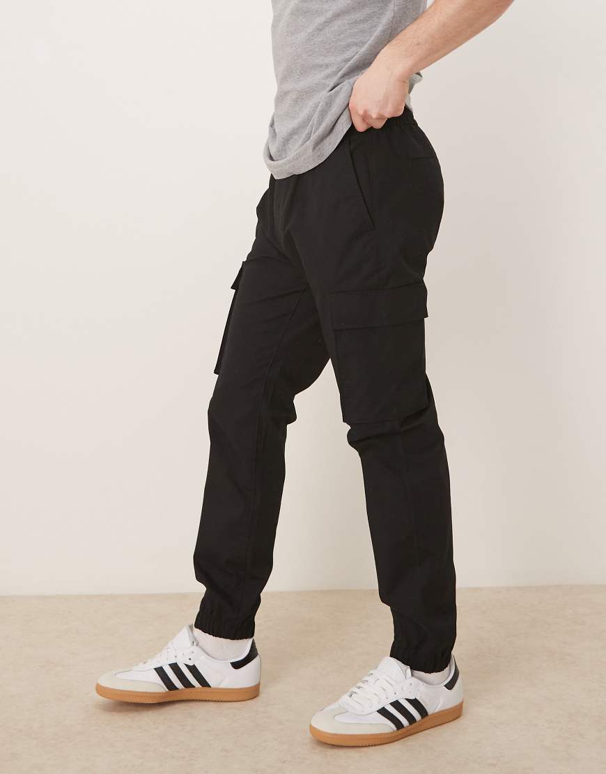 Calvin Klein Jeans - Skinny Fit Hose aus elastischem Ripstop in Schwarz Calvin Klein Jeans - Skinny Fit Hose aus elastischem Ripstop in Schwarz von Calvin Klein Jeans