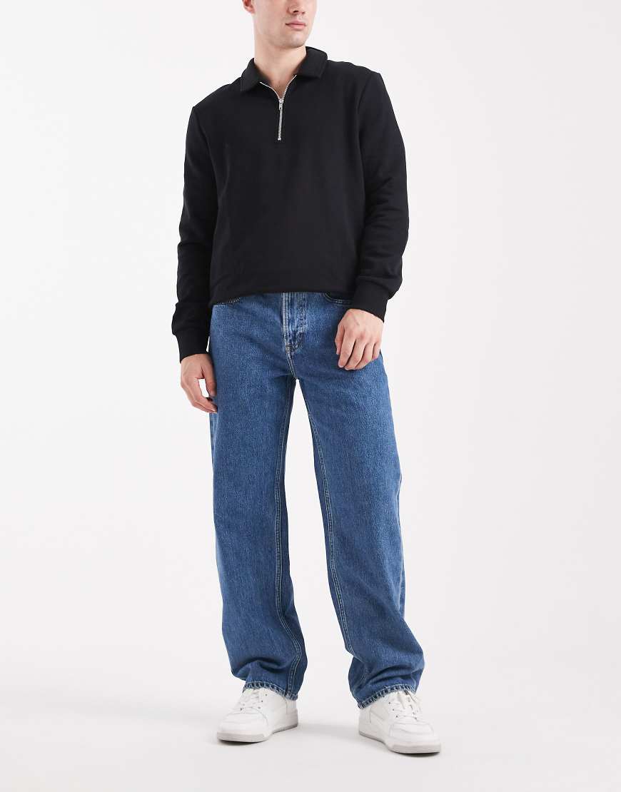Calvin Klein Jeans - Straight Jeans im 90er-Stil in mittelblauer Stone-Waschung Calvin Klein Jeans - Straight Jeans im 90er-Stil in mittelblauer Stone-Waschung von Calvin Klein Jeans