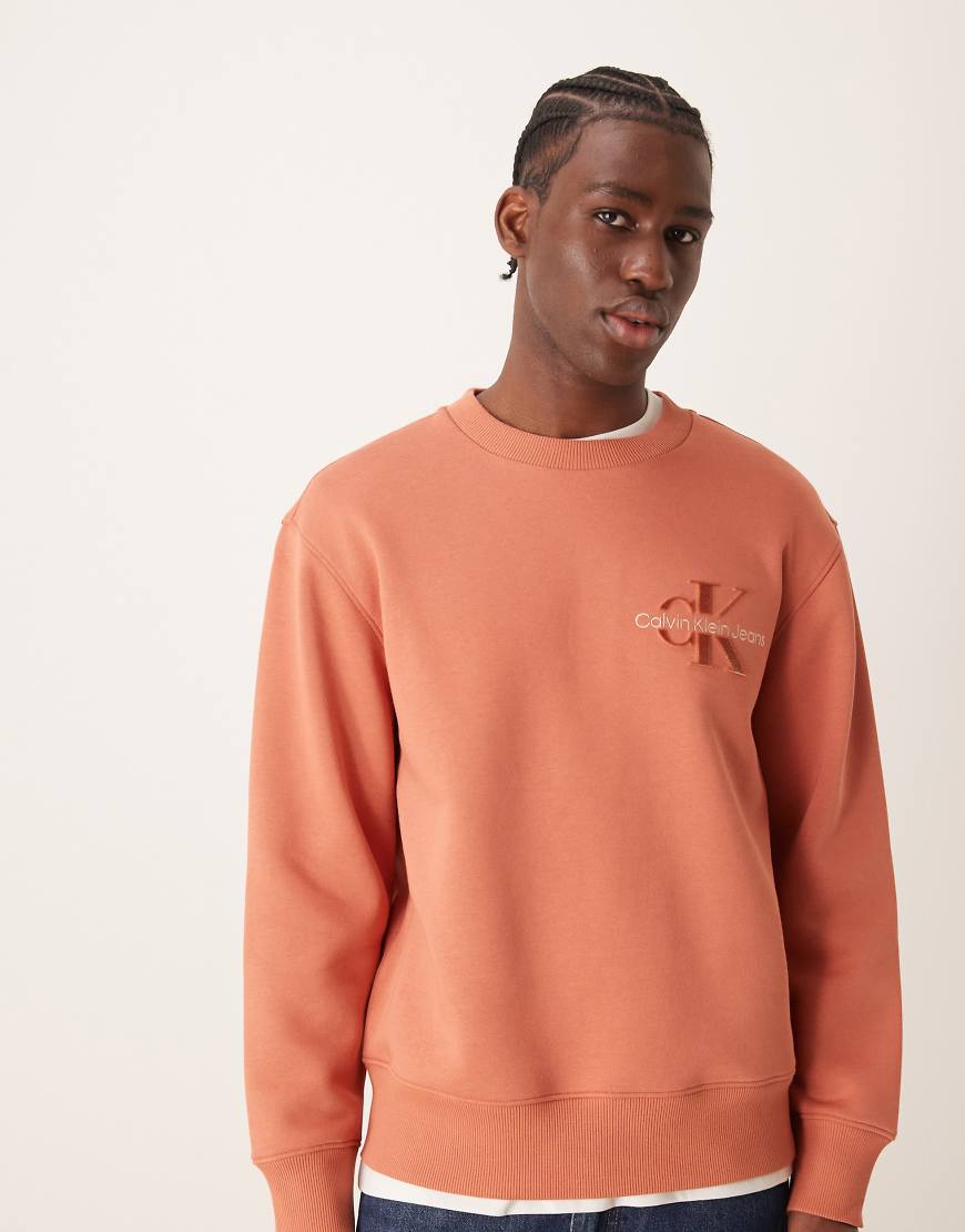 Calvin Klein Jeans - Sweatshirt aus Samt in dunklem Orange mit Logo Calvin Klein Jeans - Sweatshirt aus Samt in dunklem Orange mit Logo von Calvin Klein Jeans