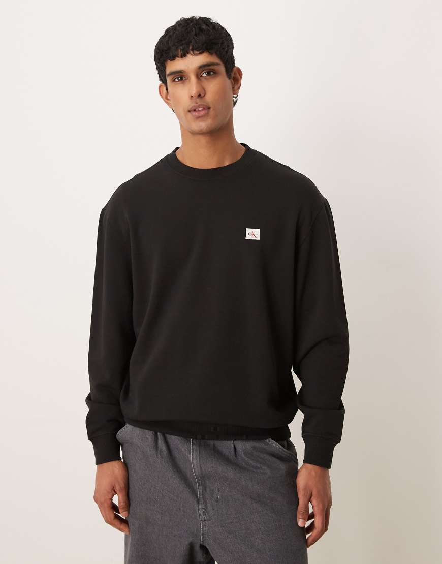 Calvin Klein Jeans - Sweatshirt in Schwarz mit kleinem Logoaufnäher von Calvin Klein Jeans
