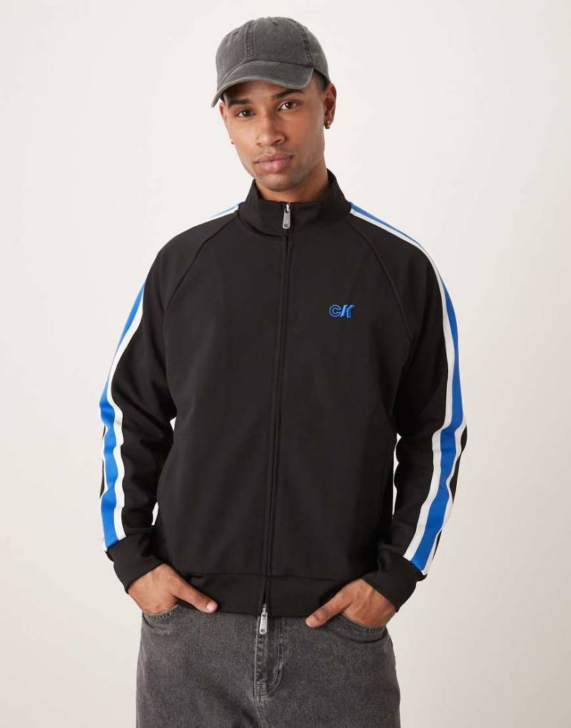Calvin Klein Jeans - Trainingsjacke in Schwarz und Blau mit Streifen von Calvin Klein Jeans