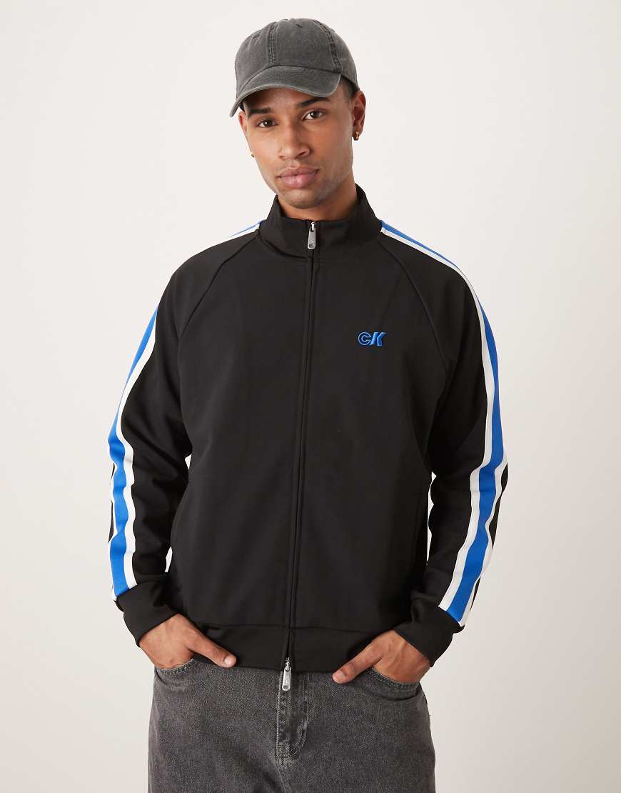 Calvin Klein Jeans - Trainingsjacke in Schwarz und Blau mit Streifen von Calvin Klein Jeans