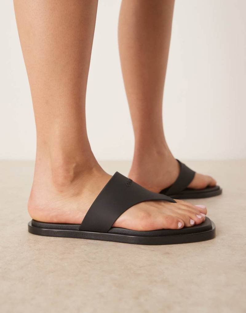 Calvin Klein Jeans - Zehenstegsandalen in Schwarz aus Leder von Calvin Klein Jeans