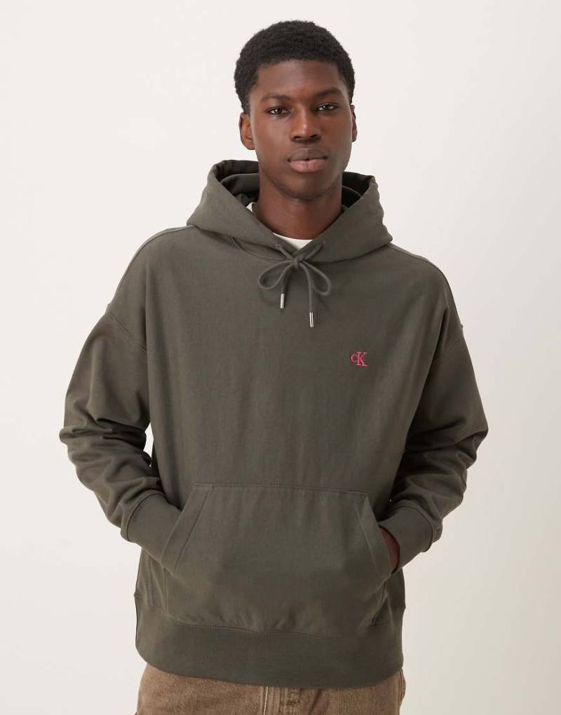 Calvin Klein Jeans - Hochwertiger Frottee-Kapuzenpullover in Dunkelgrün mit kleinem Logo von Calvin Klein