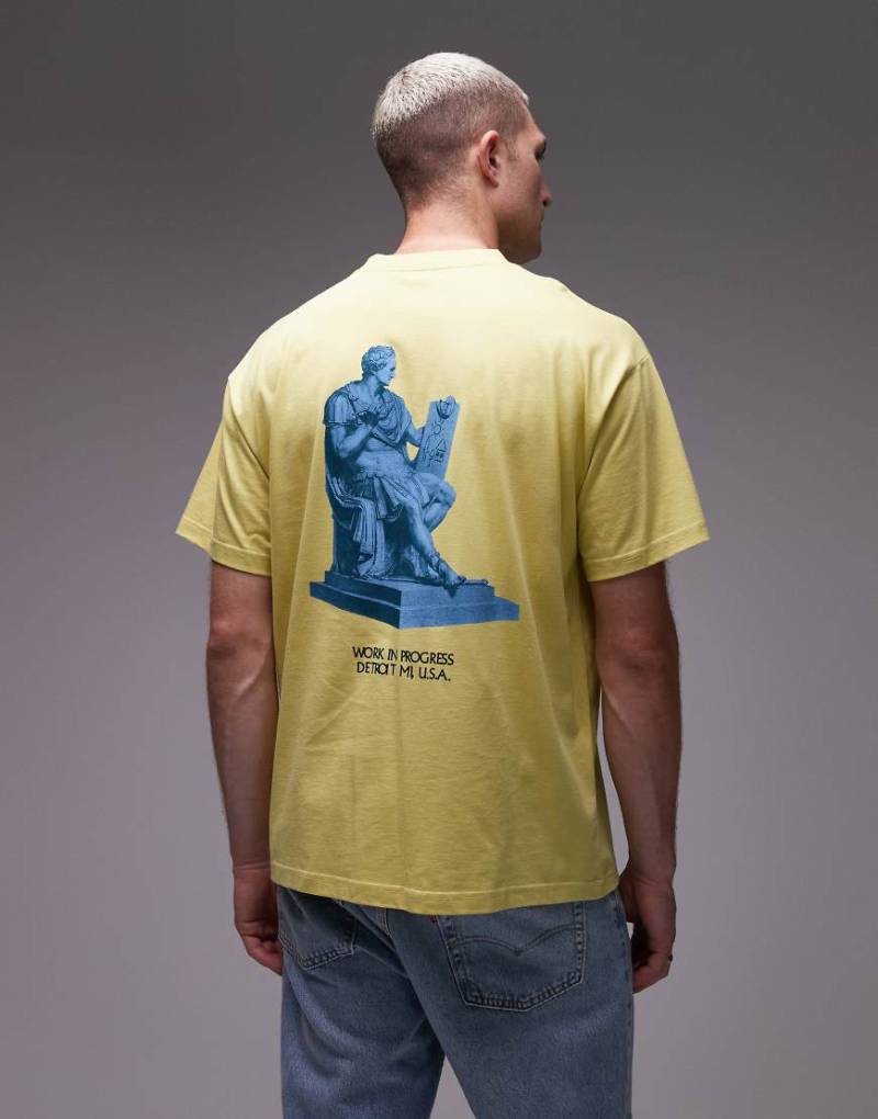 Carhartt WIP - Arcan - Loose Fit T-Shirt in Gelb mit Motivprint von Carhartt WIP