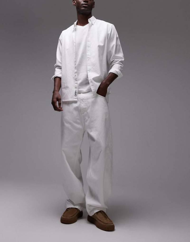 Carhartt WIP - Brandon - Lockere, schmal zulaufende Jeans in Weiß von Carhartt WIP