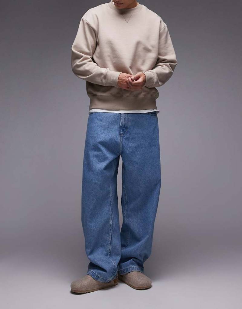 Carhartt WIP - Brandon - Weite Jeanshose in verblichener, blauer Stone-Waschung von Carhartt WIP