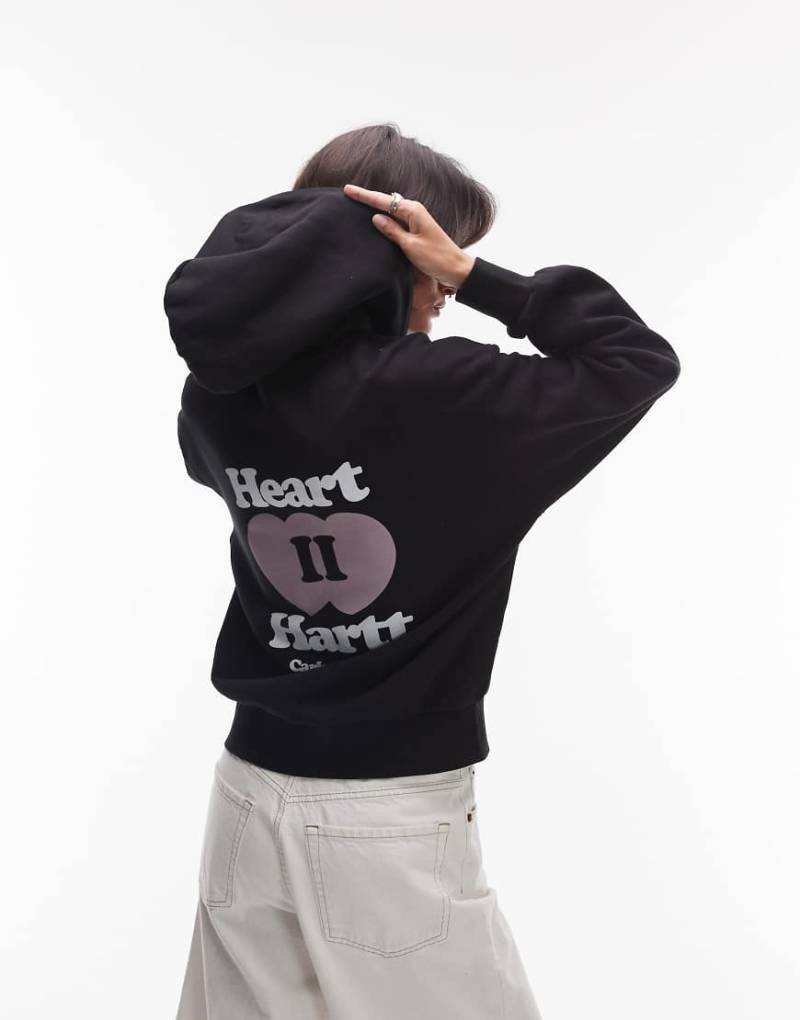Carhartt WIP - Kapuzenjacke in Schwarz mit „Heart II Hartt"-Motivprint auf dem Rücken von Carhartt WIP
