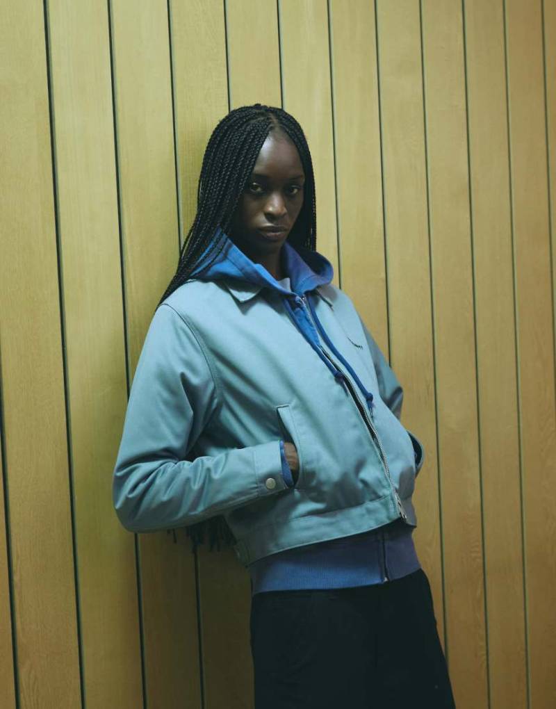 Carhartt WIP - Module - Jacke in Hellblau mit Reißverschluss und Schriftzug von Carhartt WIP