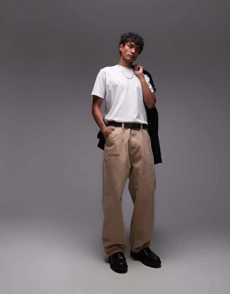 Carhartt WIP - OG - Hose in Beige mit Print und einfacher Stofflage im Kniebereich-Neutral von Carhartt WIP
