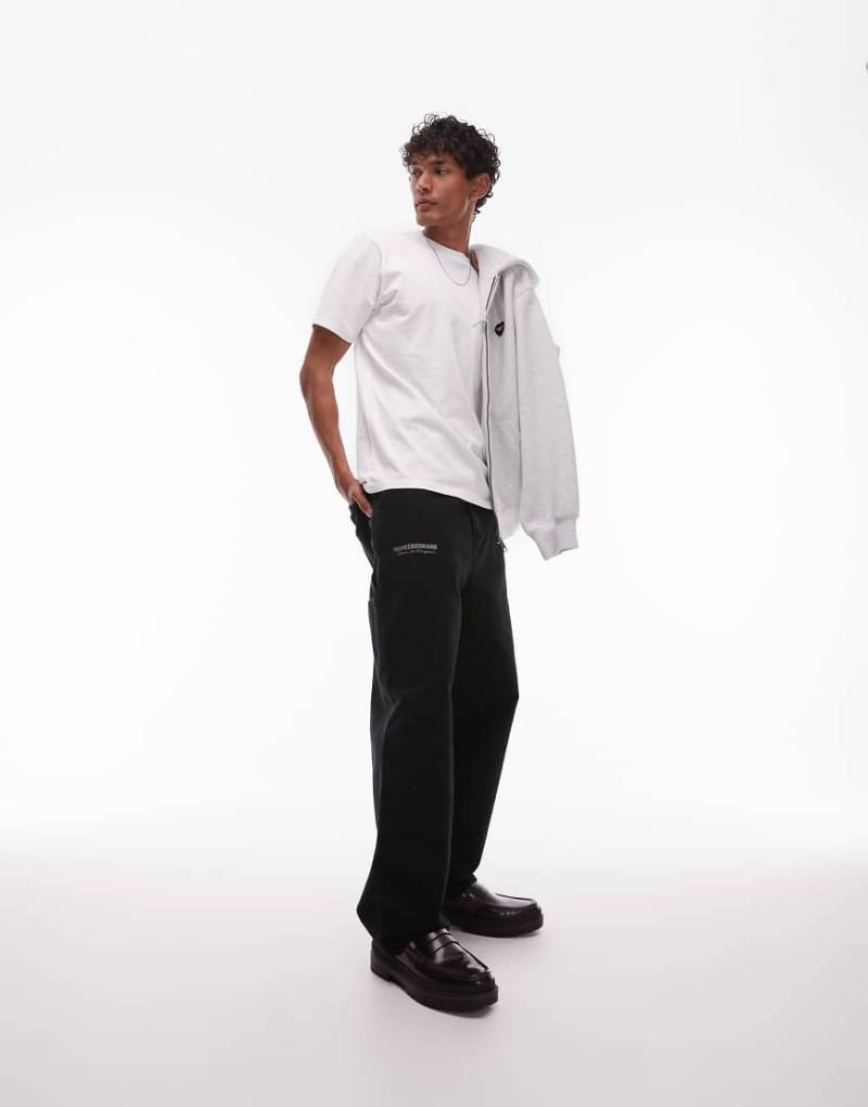 Carhartt WIP - OG - Hose in Schwarz mit Print und einfacher Stofflage im Kniebereich von Carhartt WIP