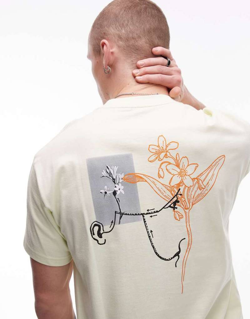 Carhartt WIP - Senses - T-Shirt in gedämpftem Gelb mit Grafik von Carhartt WIP