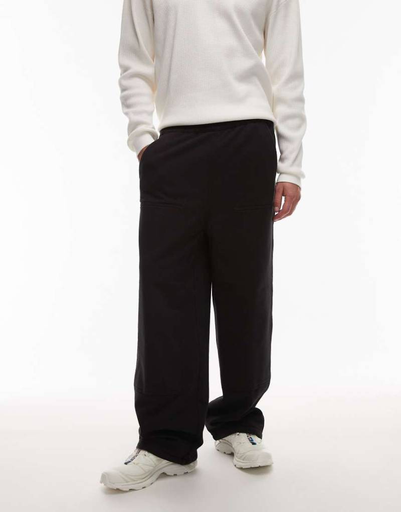 Carhartt WIP - Weite Jogginghose in Schwarz mit doppelter Stofflage im Kniebereich von Carhartt WIP