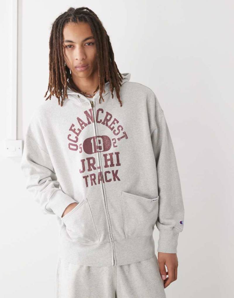 Champion - Kapuzenjacke in Grau mit durchgehendem Reißverschluss und Grafik von Champion