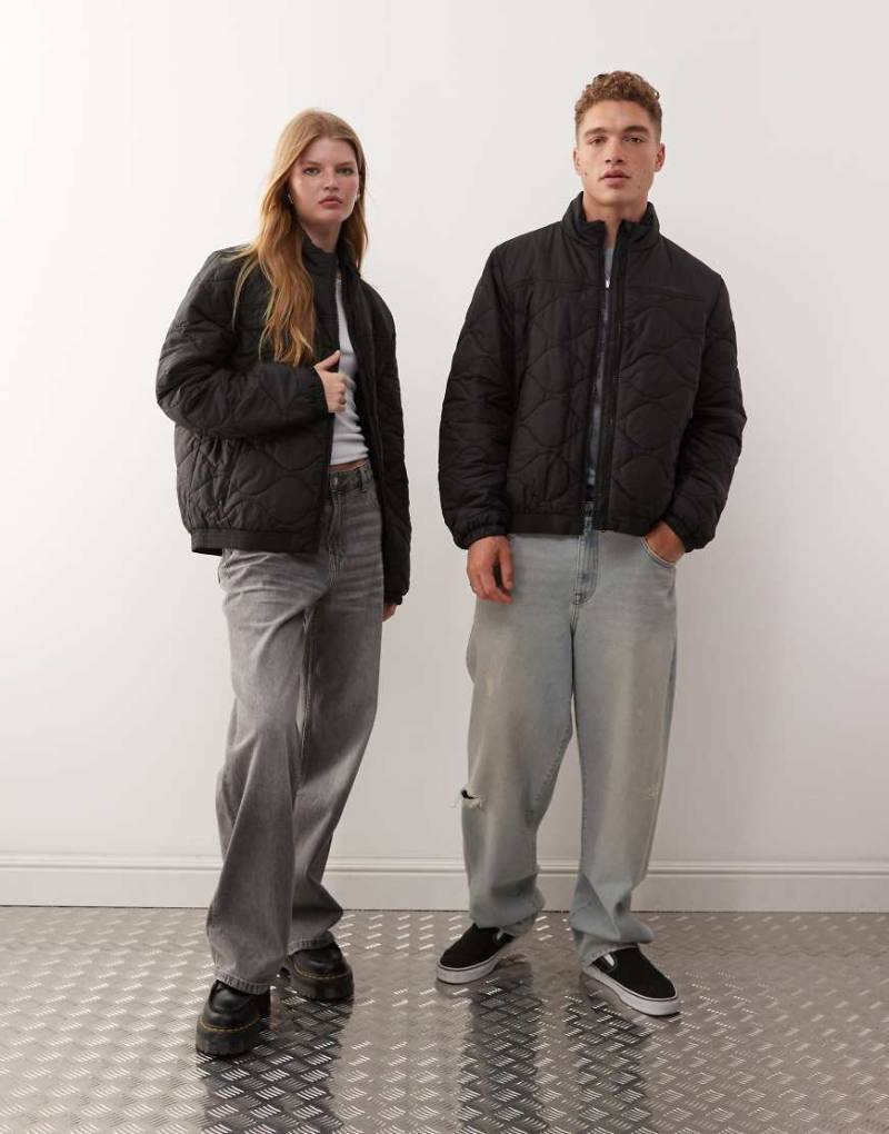 Champion - Wattierte Unisex-Jacke in Schwarz mit durchgehendem Reißverschluss von Champion