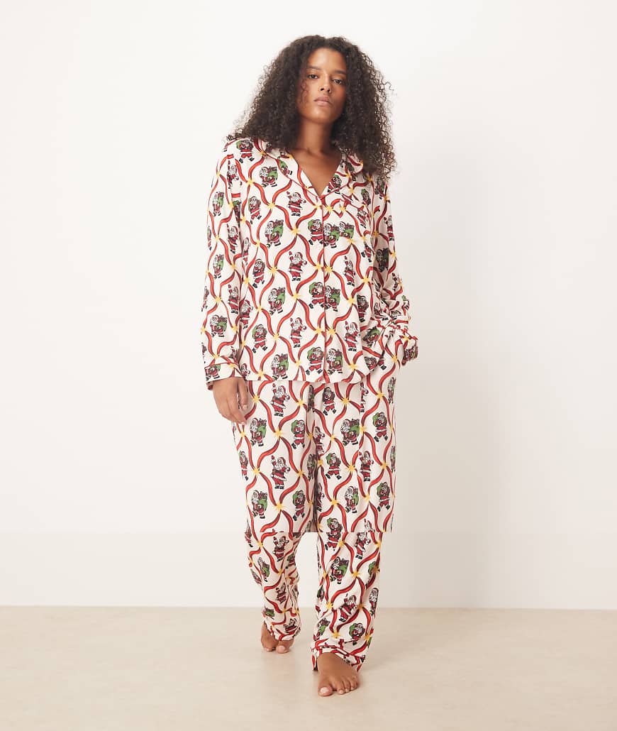 Chelsea Peers Curve - Exklusives, langärmliges Pyjama-Set aus Polyester mit Weihnachtsmann- und Zuckerstangen-Print-Weiß Chelsea Peers Curve - Exklusives, langärmliges Pyjama-Set aus Polyester mit Weihnachtsmann- und Zuckerstangen-Print-Weiß von Chelsea Peers