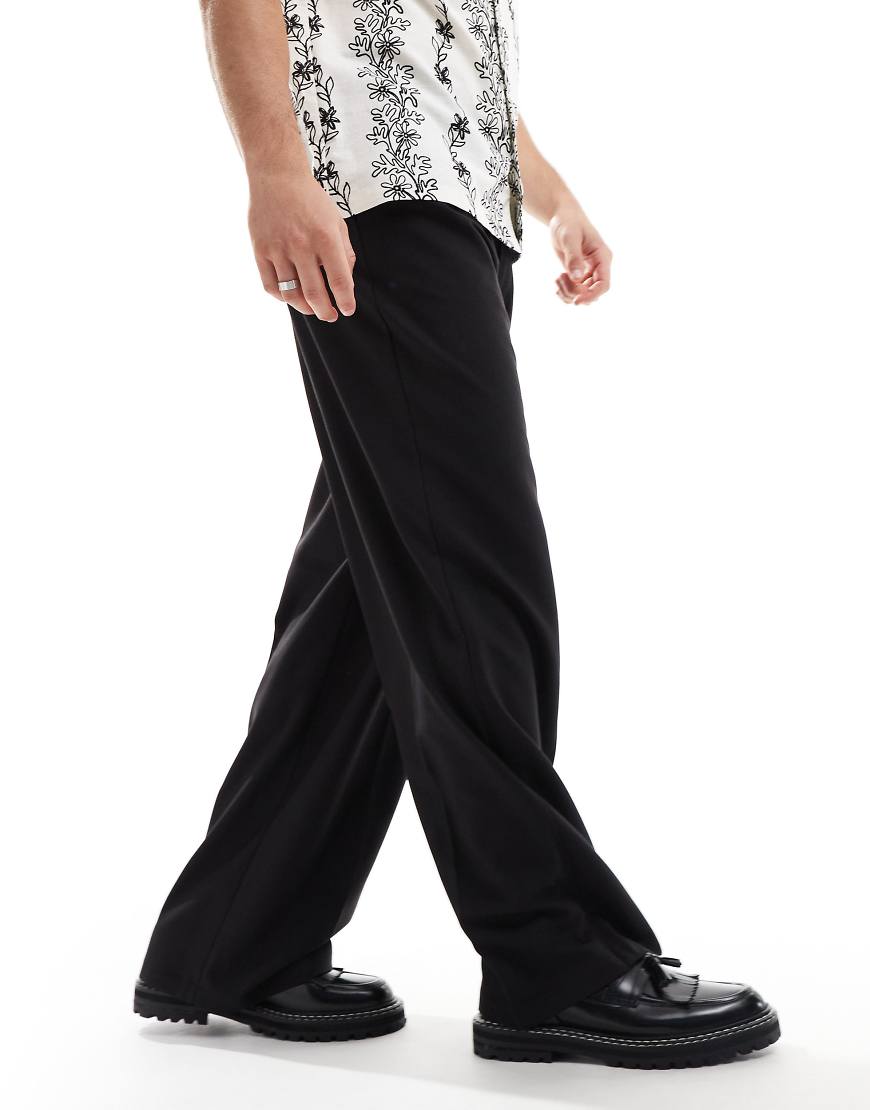 COLLUSION - Elegante Hose in Schwarz mit lockerem, weitem Schnitt COLLUSION - Elegante Hose in Schwarz mit lockerem, weitem Schnitt von Collusion