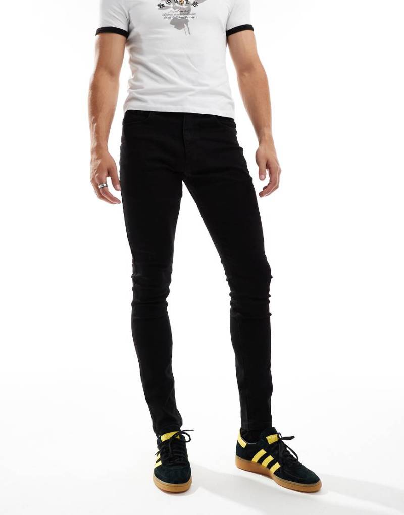 COLLUSION - Enge Jeans in Schwarz mit mittelhohem Bund COLLUSION - Enge Jeans in Schwarz mit mittelhohem Bund von Collusion