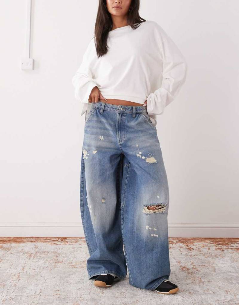 COLLUSION - X006 - Superweite Balloon-Jeans in Used-Waschung mit niedrigem Bund-Blau von Collusion