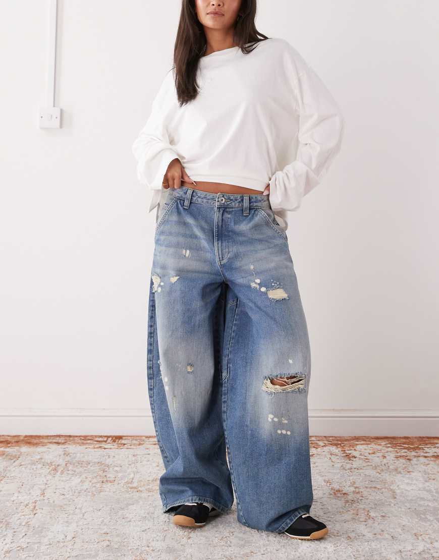 COLLUSION - X006 - Superweite Balloon-Jeans in Used-Waschung mit niedrigem Bund-Blau von Collusion