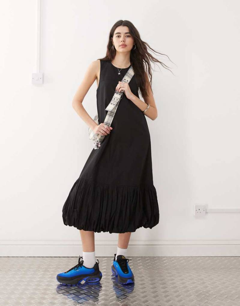 COLLUSION - Maxikleid in Schwarz mit Ballonsaum von Collusion