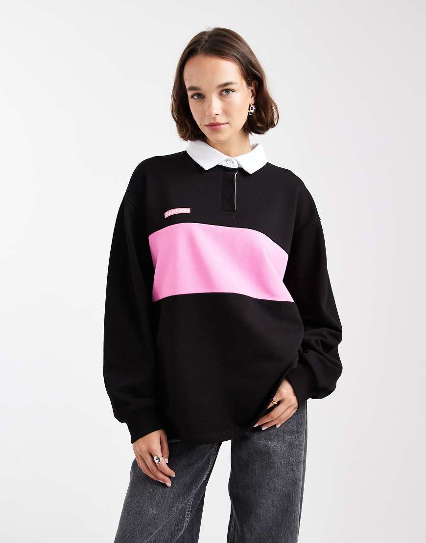 COLLUSION - Polo-Oberteil in Schwarz mit Colourblock-Design von Collusion