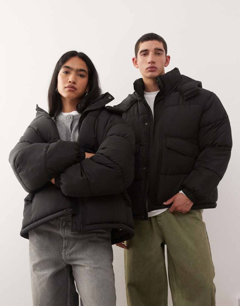 COLLUSION Unisex - Pufferjacke mit Kapuze in Schwarz COLLUSION Unisex - Pufferjacke mit Kapuze in Schwarz von Collusion