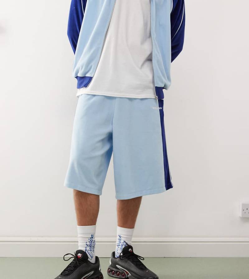 COLLUSION - Velours-Shorts in Blau mit Einsätzen, Kombiteil von Collusion