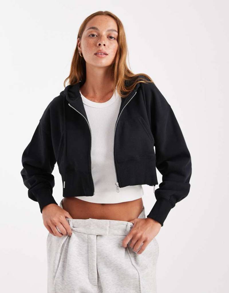 Cotton On - Cropped-Kapuzenjacke aus flauschigem Fleece in Schwarz mit durchgehendem Reißverschluss von Cotton On